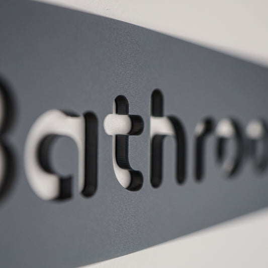Stylish grey acrylic bathroom sign with sleek black font for modern interiors