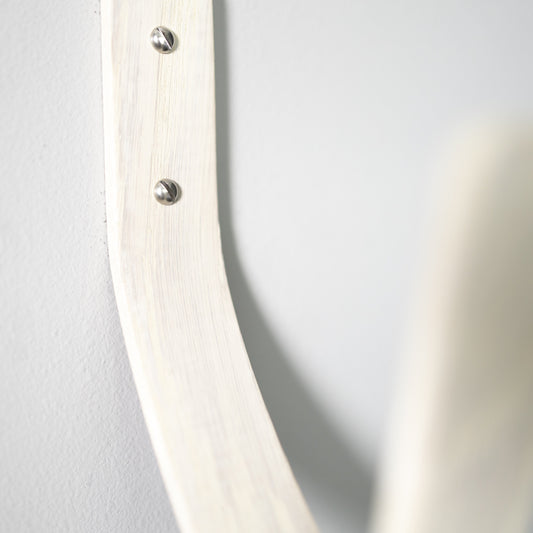 Surfboard securely mounted on wall using premium wooden wall mount