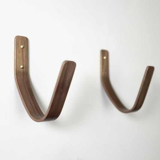 Walnut surfboard wall mount showing rich wood finish and premium craftsmanship