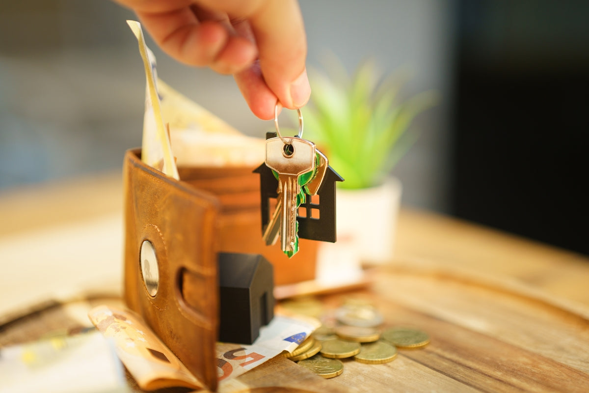 Modern entryway organization with oak wall hooks holding keys and accessories