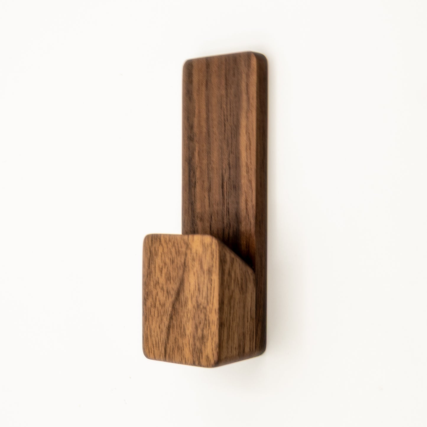 Wooden wall hook on a white background