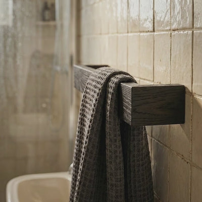 Black stained ash slimline towel rack wall mounted